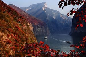 The amazing Yangtze River decorated by the red leaves on the river bank. The amazing Yangtze River decorated by the red leaves on the river bank.