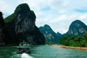Relax on the famous Li River Cruise while the picturesque Karst Landscape passes by Relax on the famous Li River Cruise while the picturesque Karst Landscape passes by
